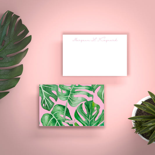 pink and green backdrop with custom stationery