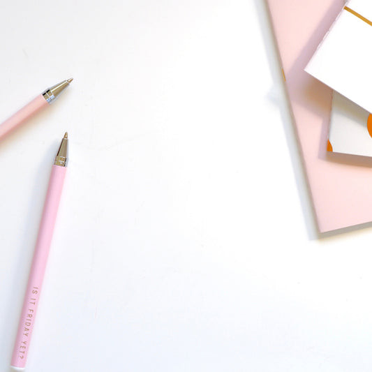 2 pink pens and pink stationery